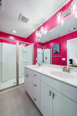 a kitchen with a sink cabinets and wooden floor
