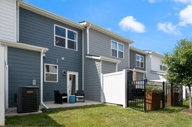 a view of a chair and fire pit in the balcony