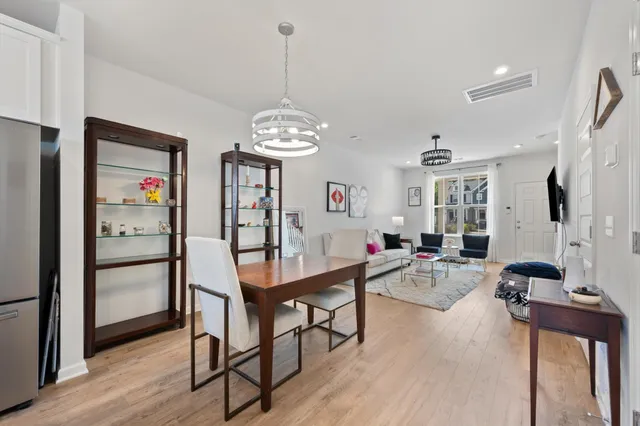 a view of a livingroom with furniture a chandelier
