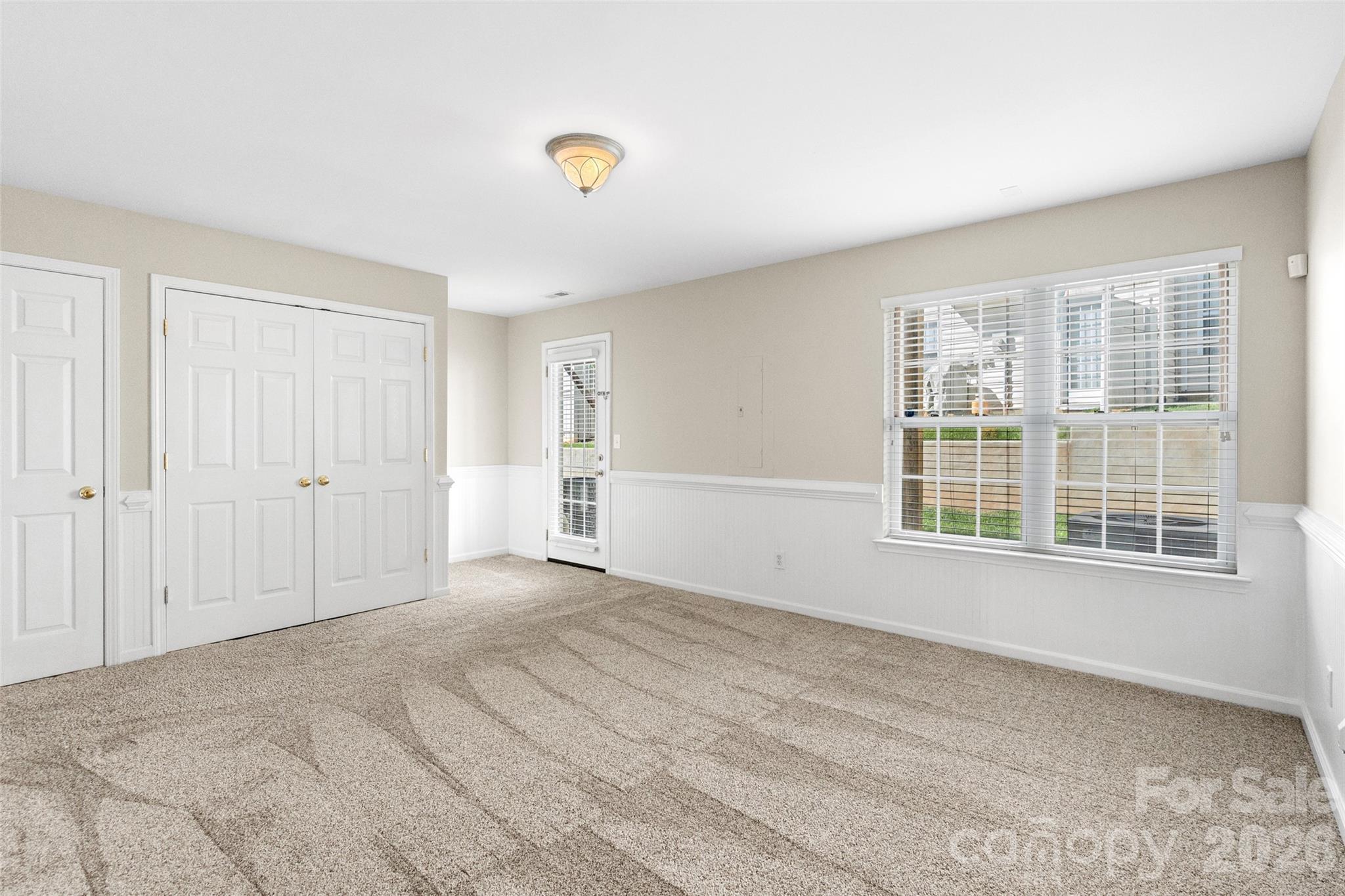 104 Rock Ridge Lane Mount Holly, NC 28120 - Photo 7 of 48 a view of an empty room with a window