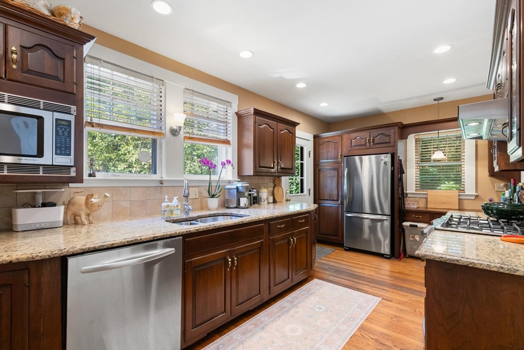 114 South Border Road Medford, MA 02155 - Photo 13 of 36 a kitchen with stainless steel appliances granite countertop a sink stove and refrigerator