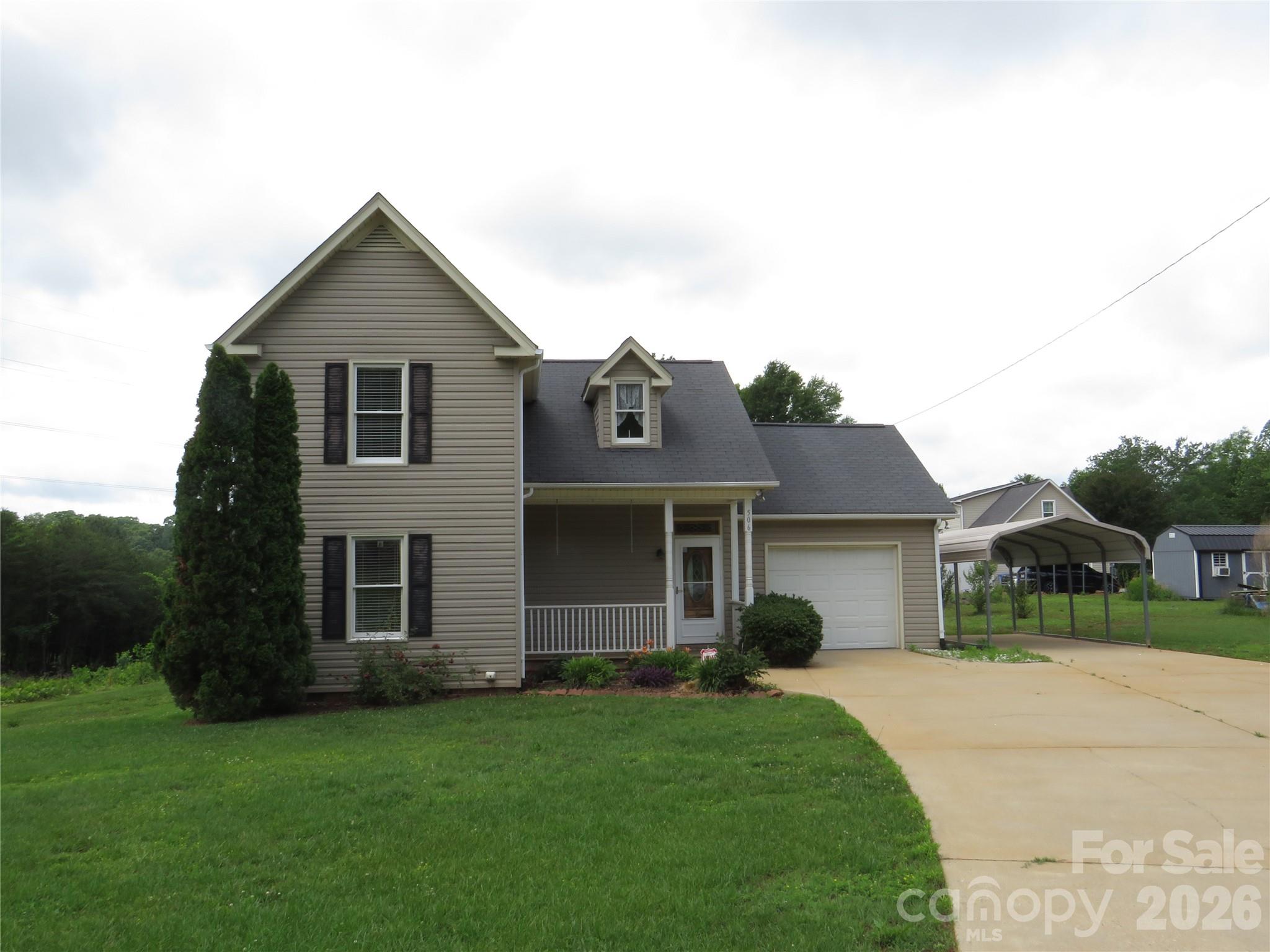 506 Pleasant Street Spindale, NC 28160 - Photo 41 of 42 a front view of a house with a yard and garage