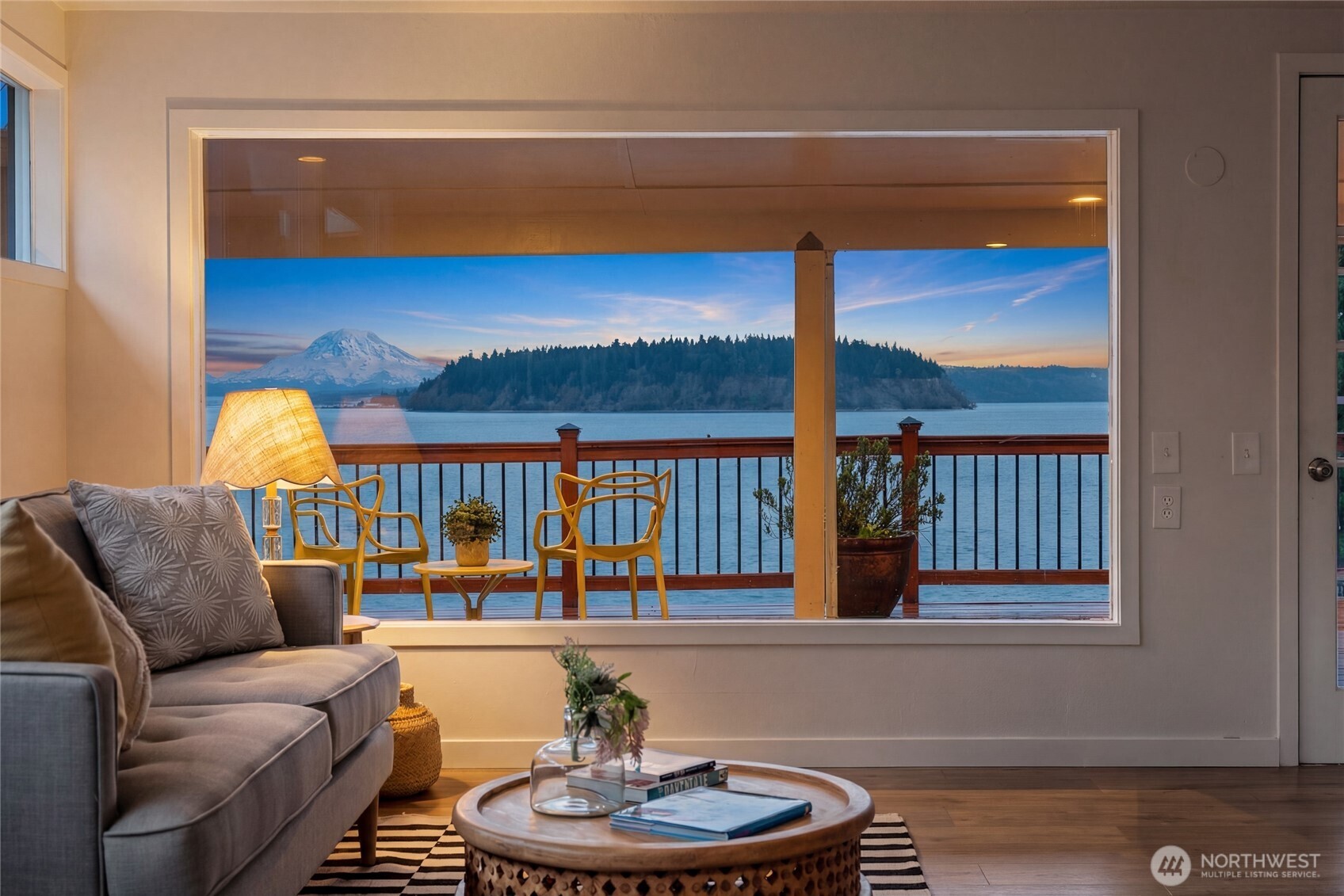 1908 Lybecker Road Northwest Gig Harbor, WA 98332 - Photo 12 of 40 a living room with furniture a rug and a floor to ceiling window