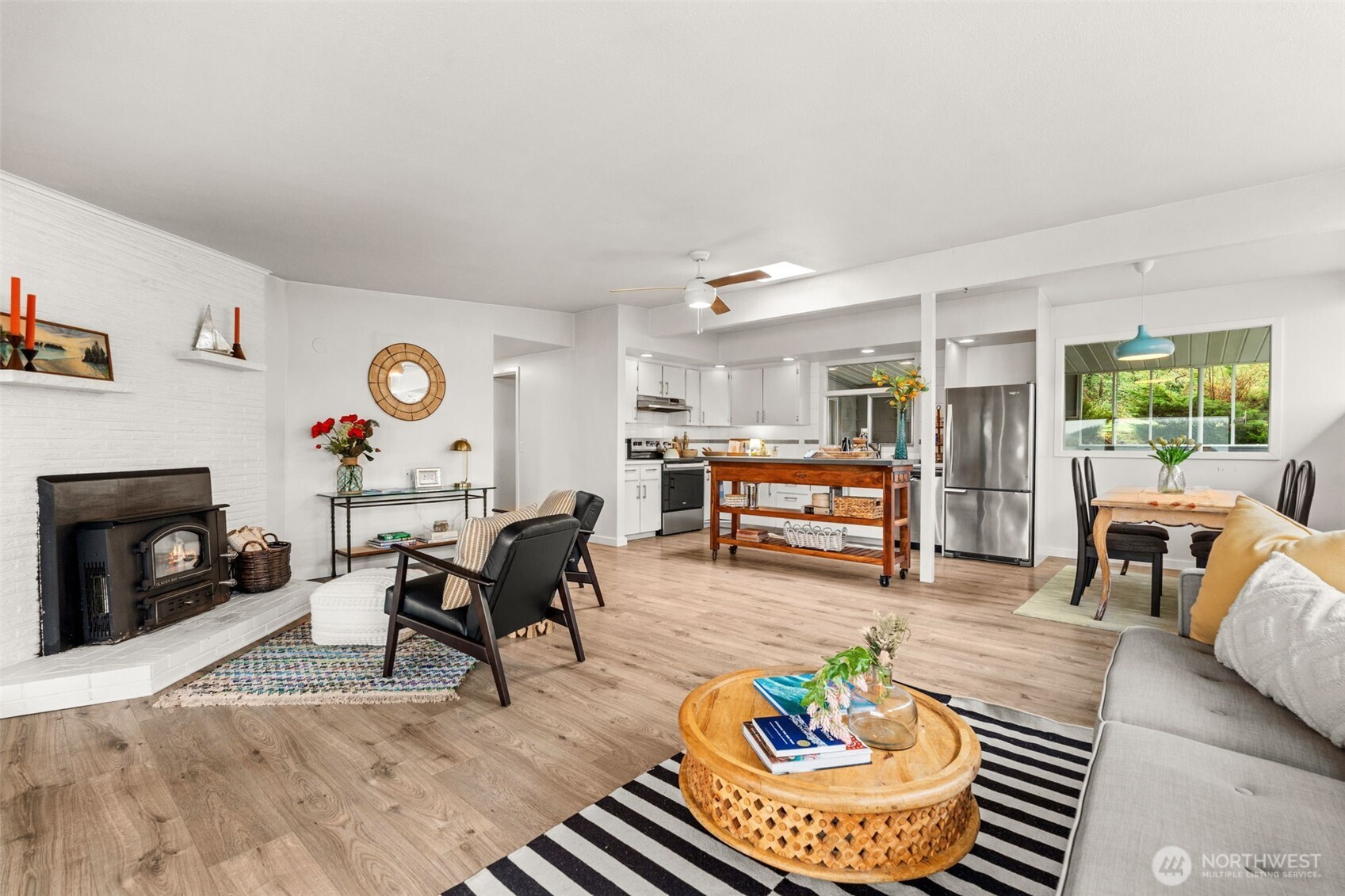 1908 Lybecker Road Northwest Gig Harbor, WA 98332 - Photo 13 of 40 a living room with furniture and a fireplace