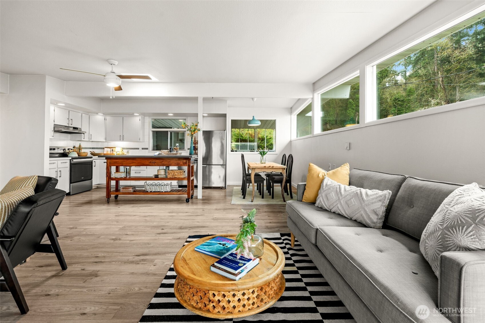 1908 Lybecker Road Northwest Gig Harbor, WA 98332 - Photo 14 of 40 a living room with furniture fireplace and a large window