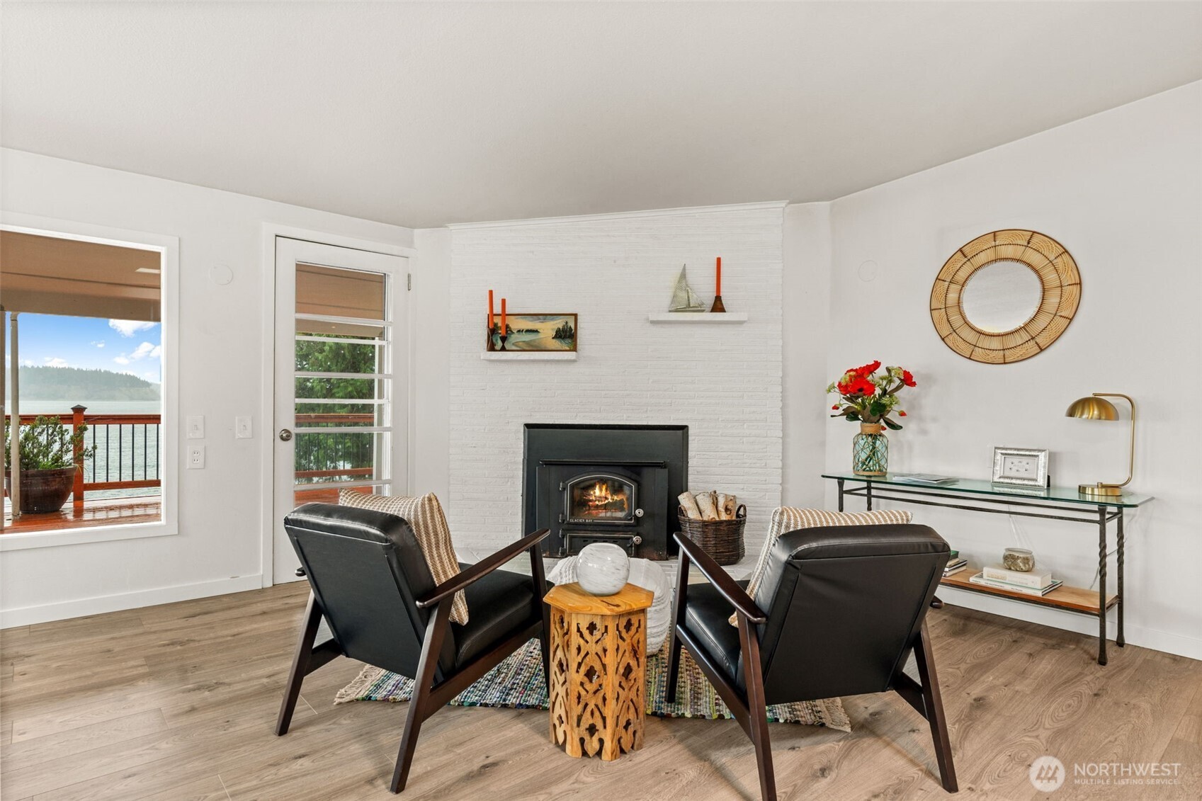 1908 Lybecker Road Northwest Gig Harbor, WA 98332 - Photo 15 of 40 a living room with furniture a window and a fireplace