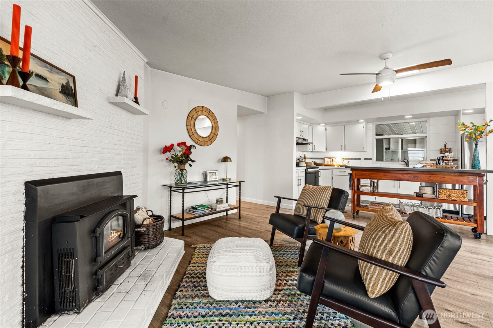 1908 Lybecker Road Northwest Gig Harbor, WA 98332 - Photo 16 of 40 a living room with furniture a flat screen tv and a fireplace
