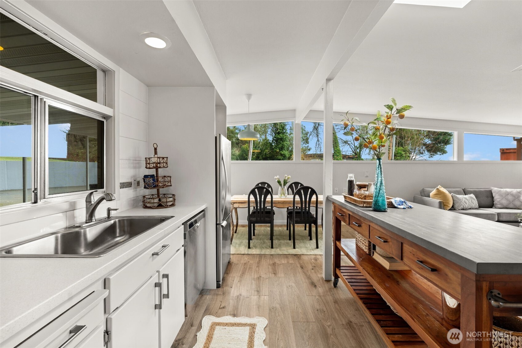 1908 Lybecker Road Northwest Gig Harbor, WA 98332 - Photo 21 of 40 a kitchen with furniture wooden floor and a window
