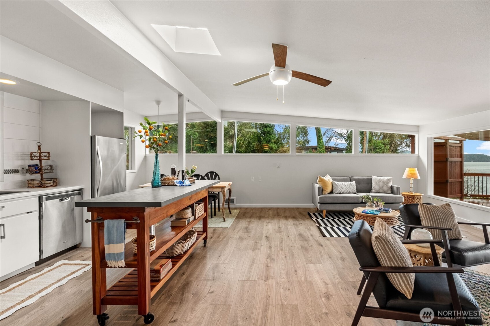1908 Lybecker Road Northwest Gig Harbor, WA 98332 - Photo 22 of 40 a living room with furniture and a wooden floor