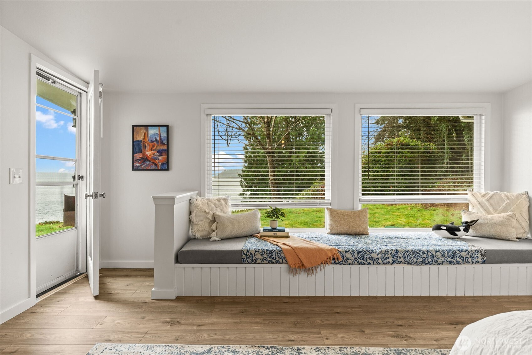 1908 Lybecker Road Northwest Gig Harbor, WA 98332 - Photo 24 of 40 a living room with furniture and floor to ceiling windows