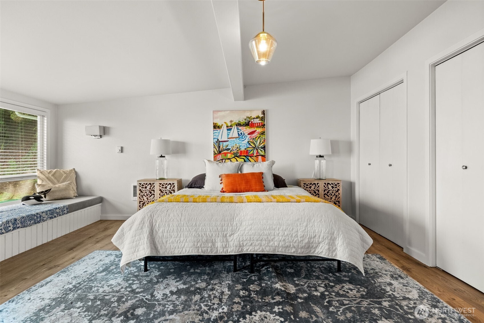 1908 Lybecker Road Northwest Gig Harbor, WA 98332 - Photo 25 of 40 a bedroom with a bed and wooden floor