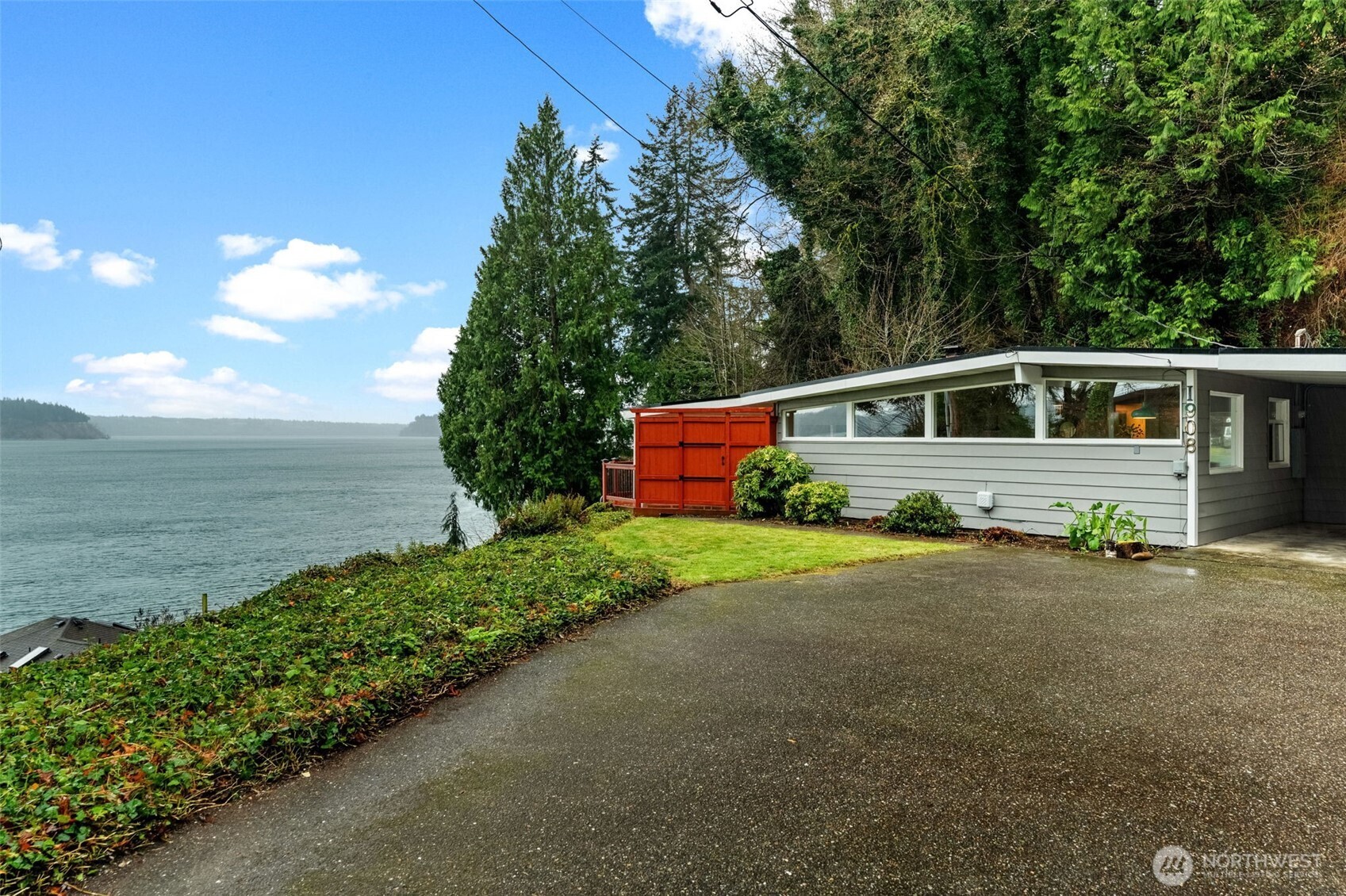 1908 Lybecker Road Northwest Gig Harbor, WA 98332 - Photo 4 of 40 a front view of a house with a yard