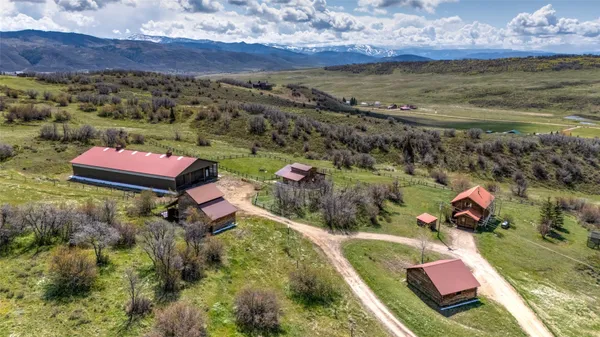 a aerial view of a house with a yard