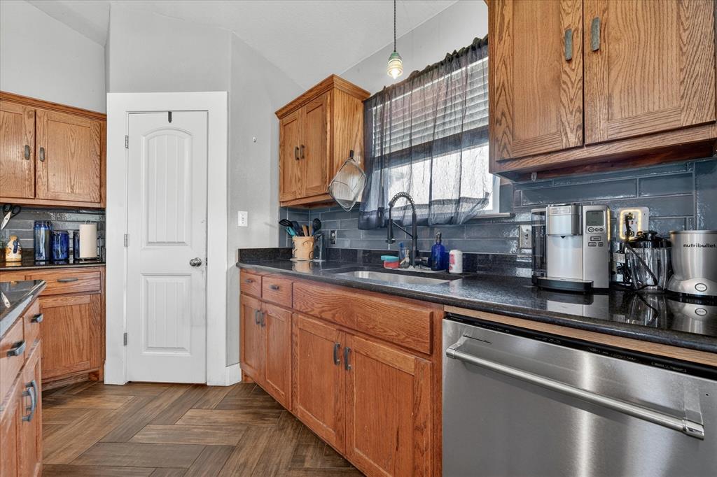 7145 Donald Road Krum, TX 76249 - Photo 11 of 35 a kitchen with stainless steel appliances granite countertop a refrigerator sink and cabinets