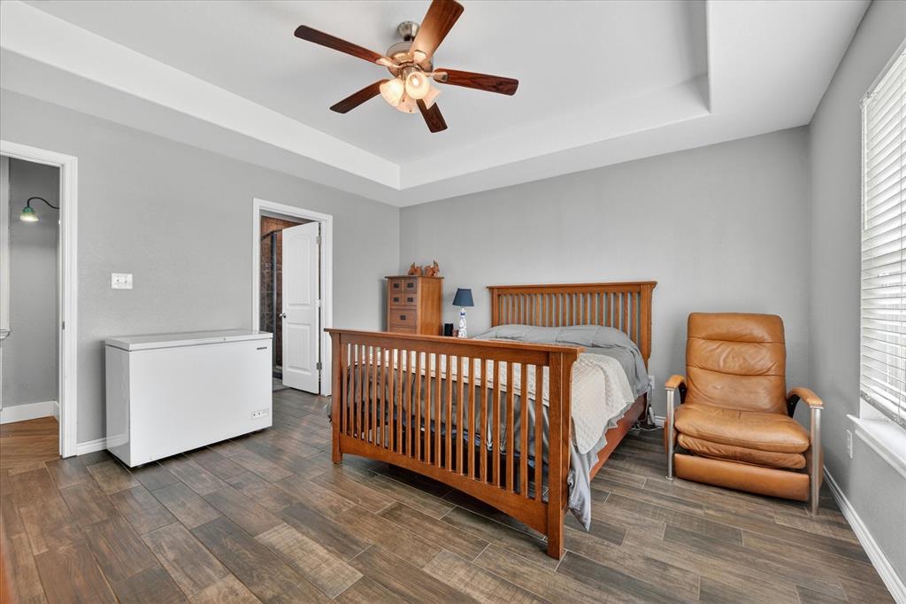 7145 Donald Road Krum, TX 76249 - Photo 24 of 35 a bedroom with furniture and a window