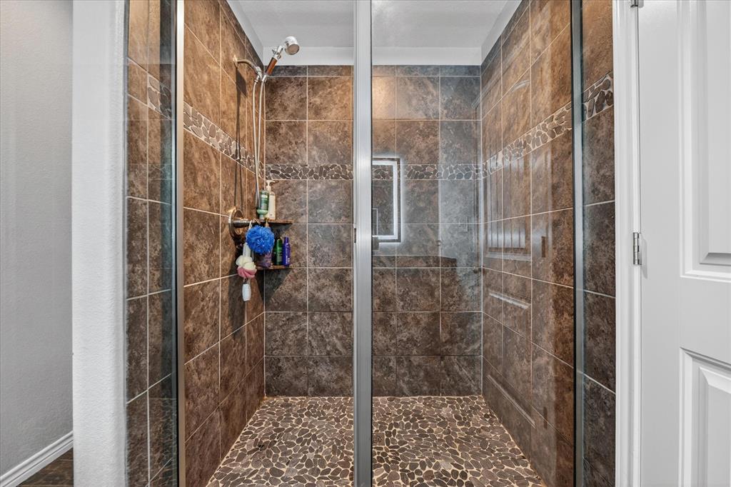 7145 Donald Road Krum, TX 76249 - Photo 28 of 35 a bathroom with a shower