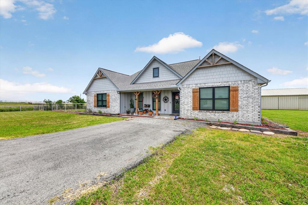 7145 Donald Road Krum, TX 76249 - Photo 3 of 35 a view of house with garden and yard