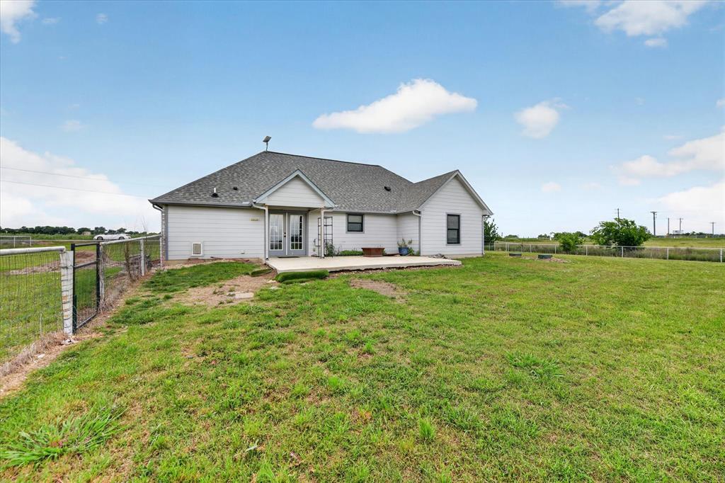 7145 Donald Road Krum, TX 76249 - Photo 32 of 35 a front view of a house with garden