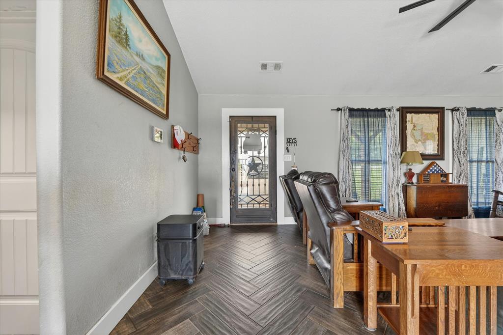 7145 Donald Road Krum, TX 76249 - Photo 7 of 35 a view of a livingroom with furniture wooden floor and windows