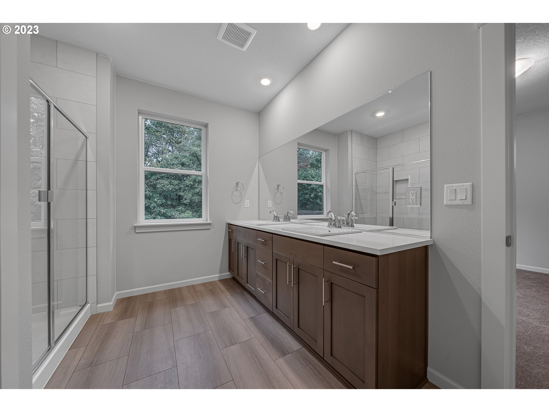 724 South 29th Court Ridgefield, WA 98642 - Photo 18 of 27 a bathroom with a granite countertop sink mirror and window