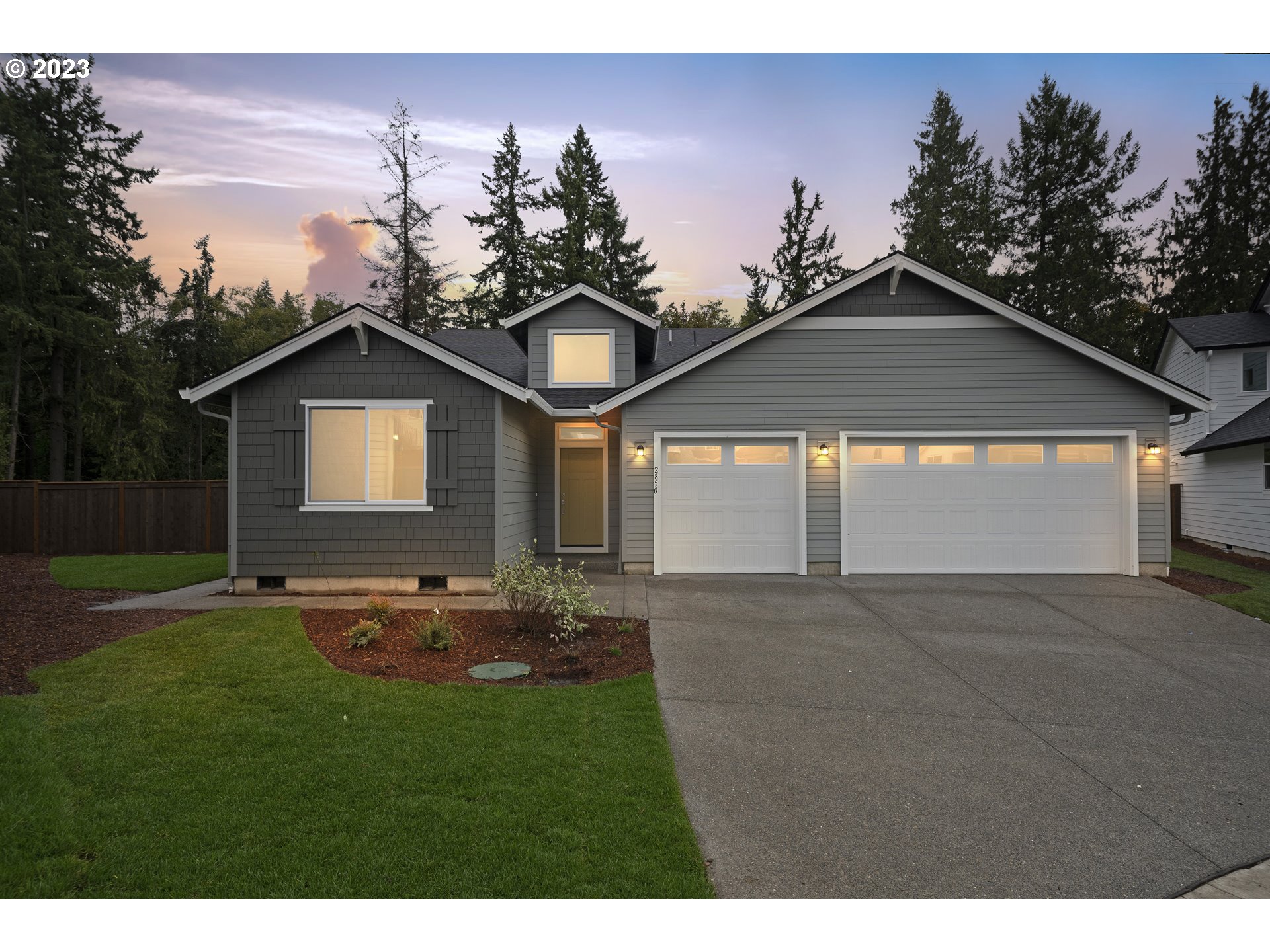 724 South 29th Court Ridgefield, WA 98642 - Photo 2 of 27 a front view of a house with a yard and garage