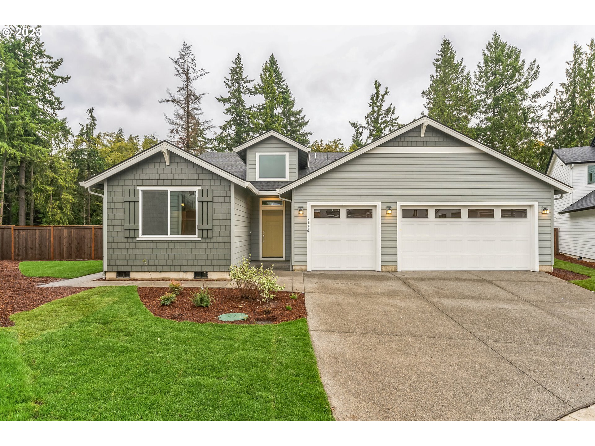 724 South 29th Court Ridgefield, WA 98642 - Photo 4 of 27 a front view of a house with a yard and garage