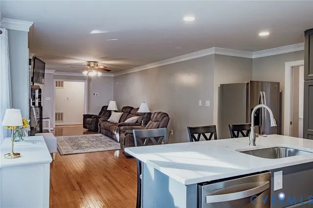 a kitchen with refrigerator and sink