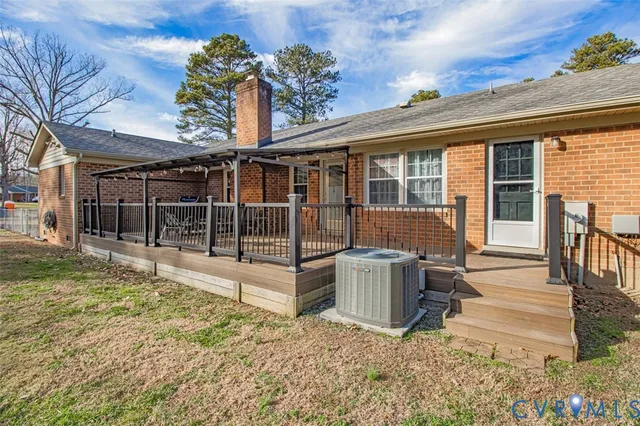 a view of a house with a wooden floor and fence