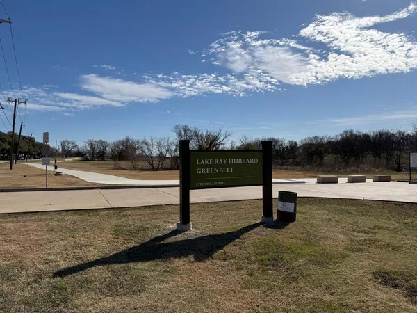 a view of a backyard with seating space