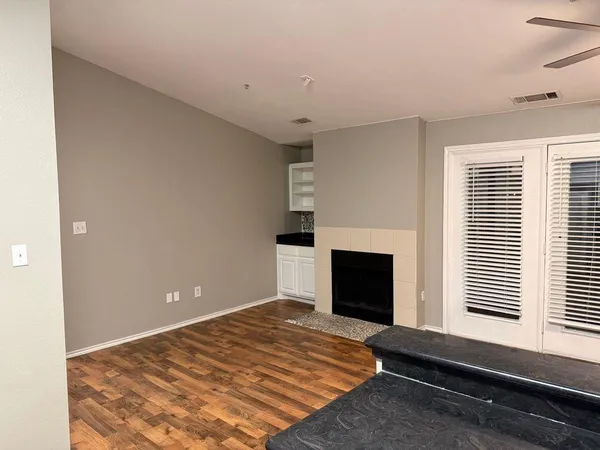 a bedroom with a bed and a fireplace