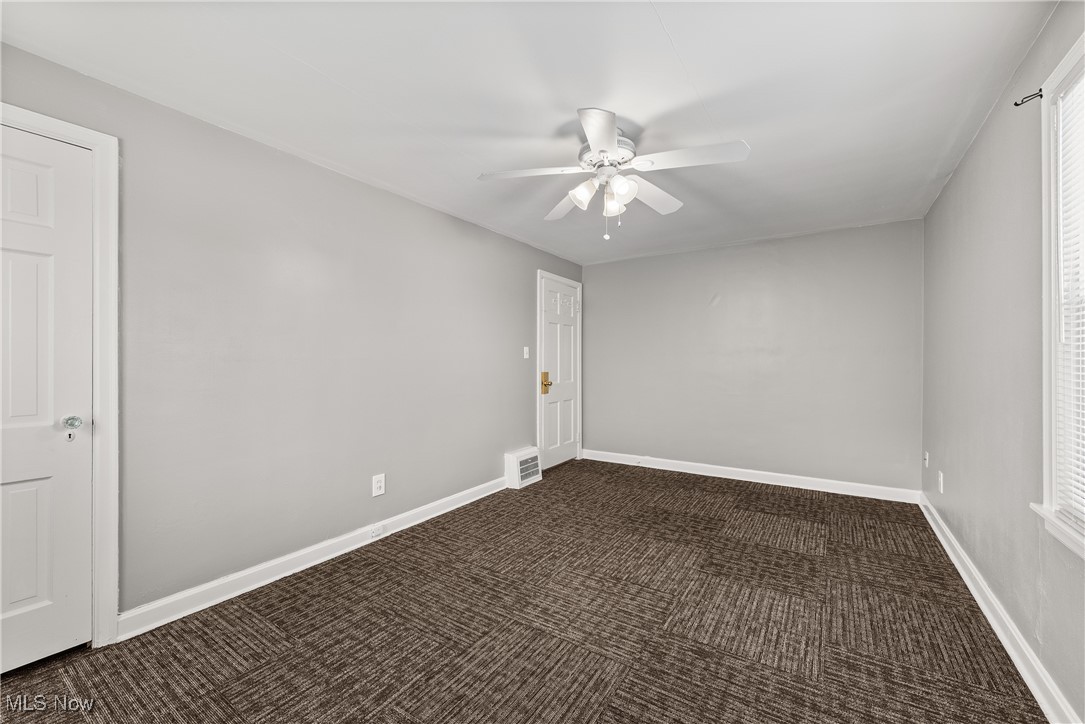 4041 Wilmington Road Cleveland, OH 44121 - Photo 22 of 38 Spare room with dark colored carpet and a ceiling fan