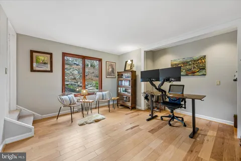 a view of a dining room with furniture and a rug
