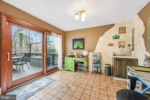 a kitchen with stainless steel appliances granite countertop a stove a sink dishwasher and a microwave oven with cabinets