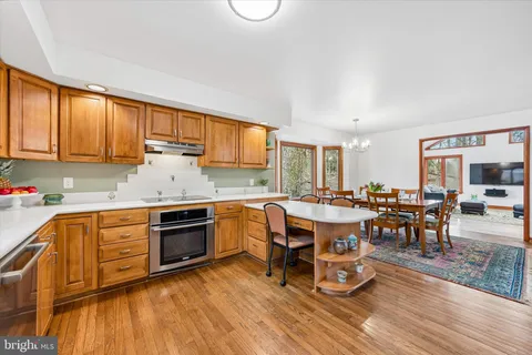 a view of a hallway with paintings on the wall