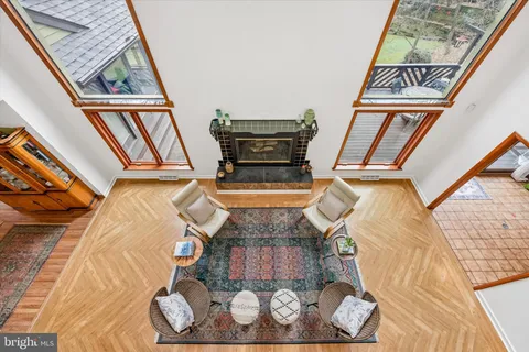 a view of a chairs and table in the balcony