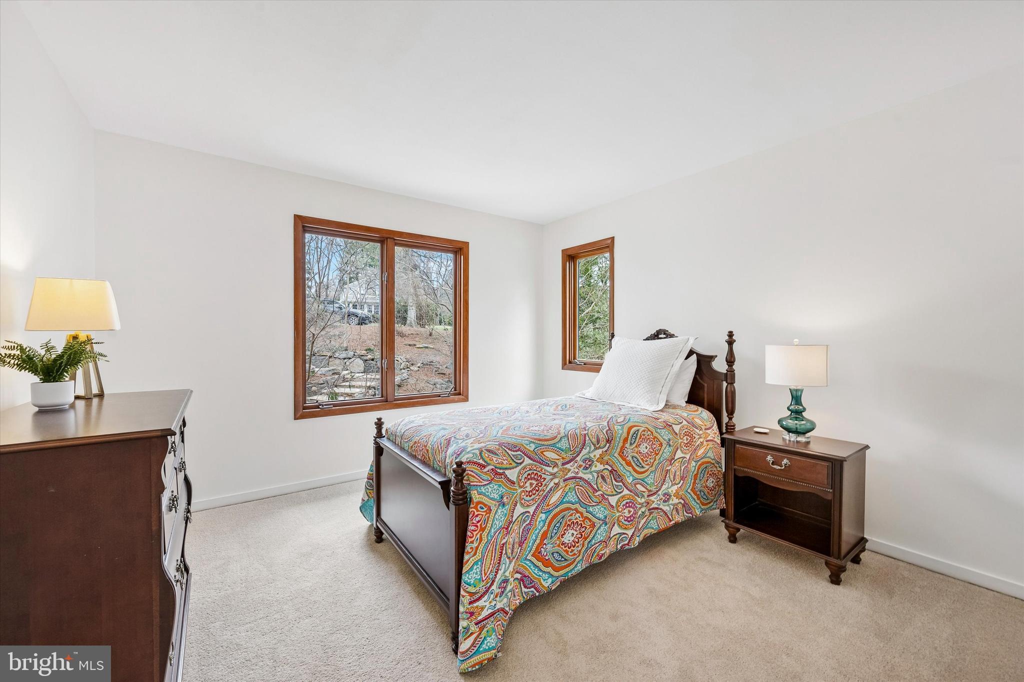 2 Lake Avenue Wallingford, PA 19086 - Photo 34 of 60 a bed sitting in a bedroom next to a window