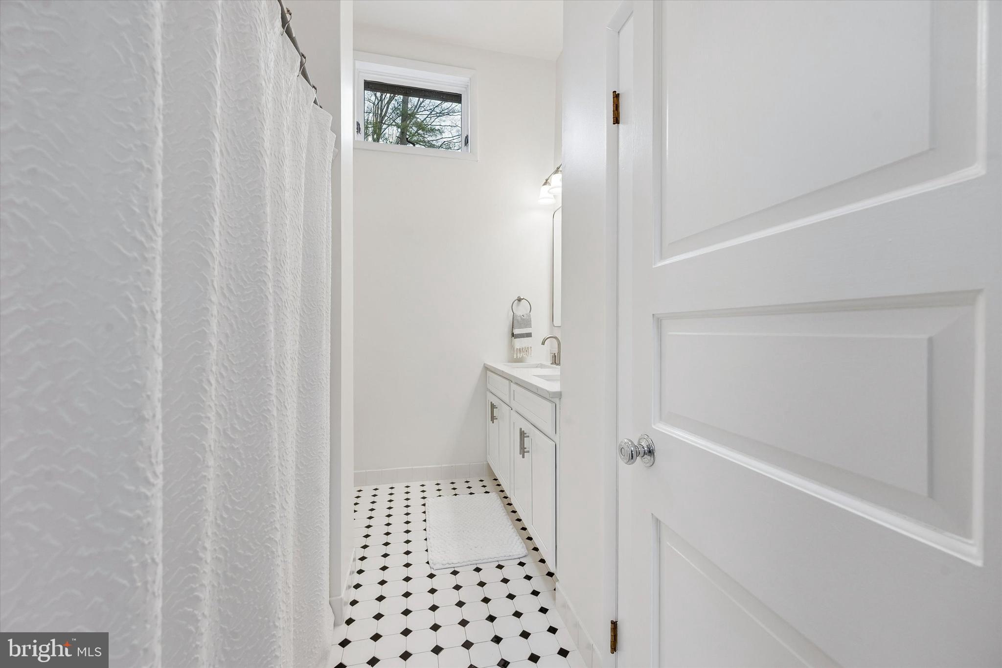 2 Lake Avenue Wallingford, PA 19086 - Photo 36 of 60 a bathroom with a sink and a shower