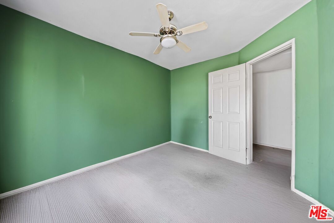 5400 Simpson Avenue, Unit 9 Valley Village, CA 91607 - Photo 15 of 30 a view of a big room with a chandelier fan and stairs