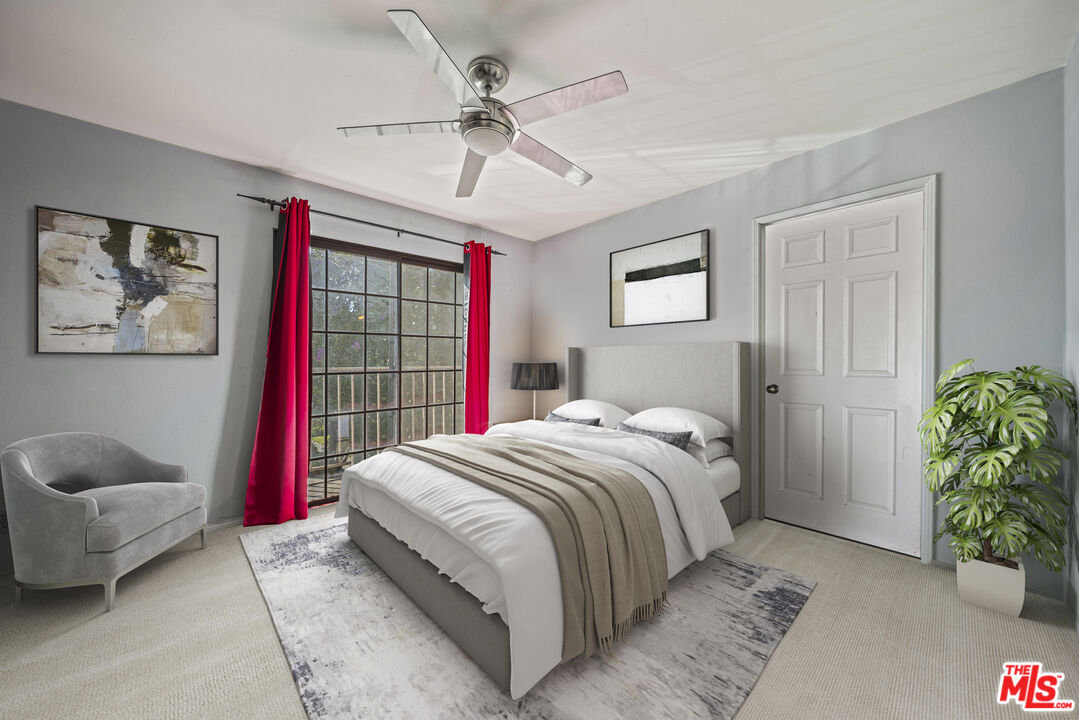 5400 Simpson Avenue, Unit 9 Valley Village, CA 91607 - Photo 23 of 30 a bedroom with a bed and a couch