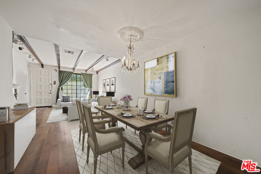 5400 Simpson Avenue, Unit 9 Valley Village, CA 91607 - Photo 6 of 30 a view of a dining room with furniture window and wooden floor