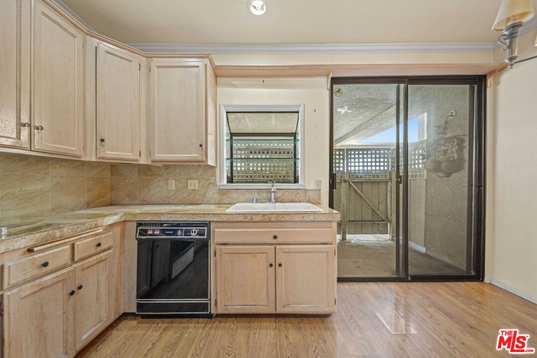 5400 Simpson Avenue, Unit 9 Valley Village, CA 91607 - Photo 10 of 30 a kitchen with white cabinets and white appliances