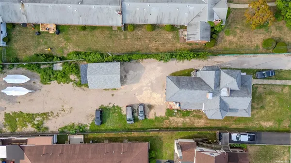 an aerial view of house with a yard