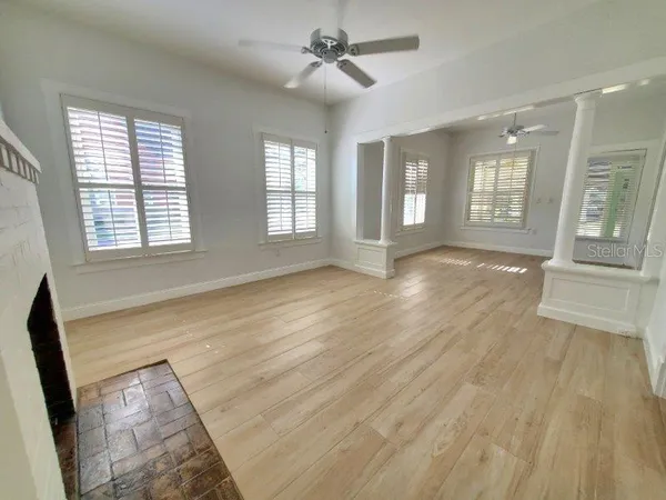 a kitchen with a refrigerator a stove a sink and a window