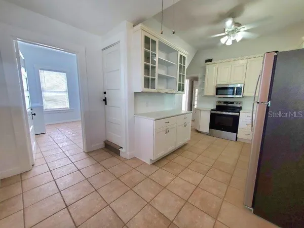 a kitchen with stainless steel appliances a refrigerator and a sink