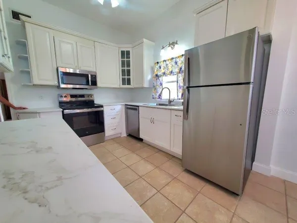 a room with a cabinets and a window