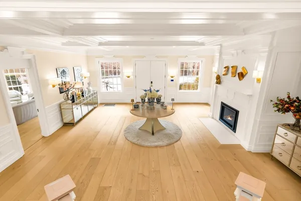 a kitchen with stainless steel appliances cabinets and a large window