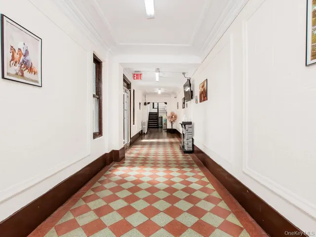 a view of a hallway with workspace