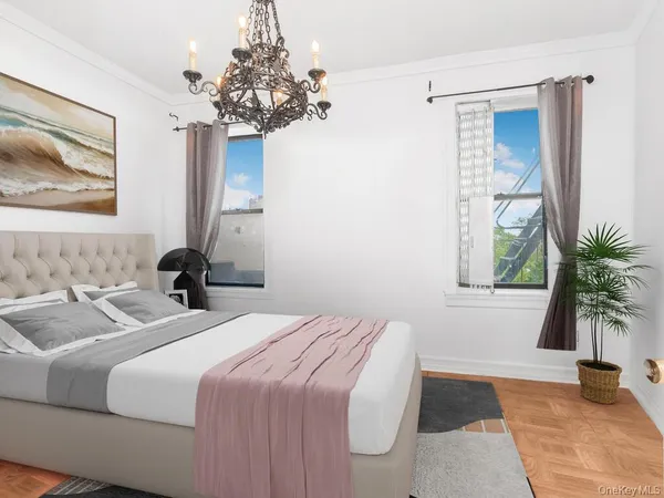 a bedroom with bed and a potted plant