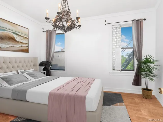 a bedroom with bed and a potted plant