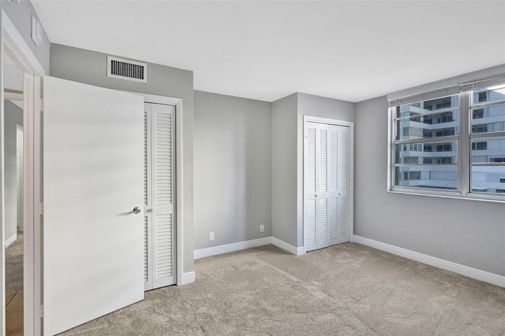 1900 South Ocean Boulevard, Unit 2F Lauderdale-by-the-Sea, FL 33062 - Photo 13 of 34 an empty room with windows